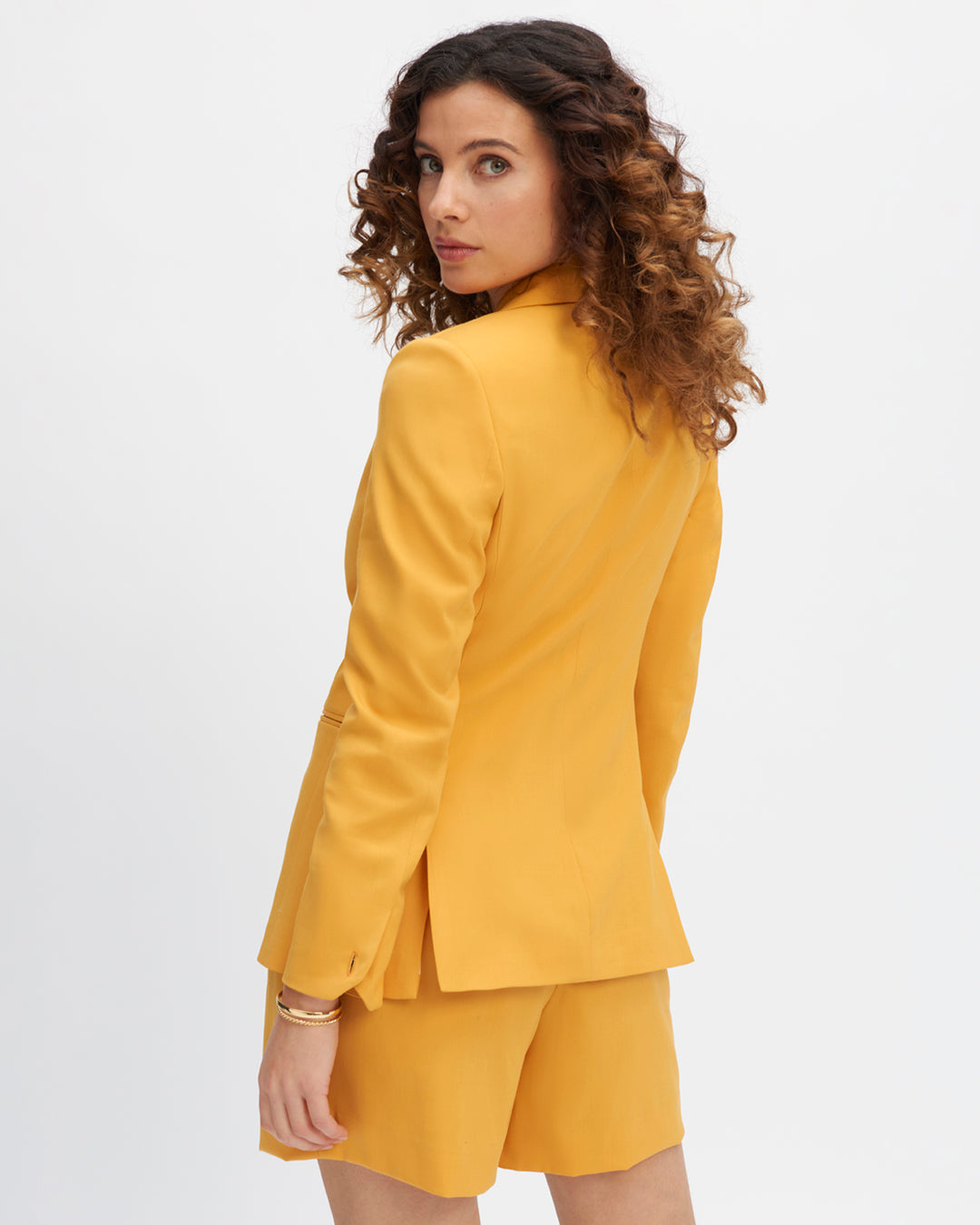 Long-sleeved jacket-yellow-cropped-and-curved-sleeved-collar-detachable-belt-on-tone-on-tone-two-short-slits-on-the-back-for-a-pretty-drop